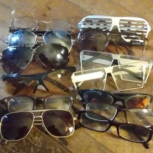 13 pairs of glasses and sunglasses